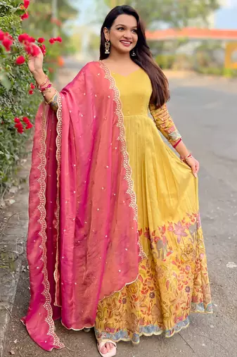 Yellow luxrious elegant position print embroidered gown paired with a contrast dupatta