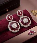 Red color kundan earrings featuring stylish modern jewelry collection for girls