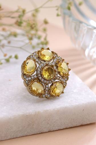 Yellow color american diamond ring featuring stylish crystal fashion appeal