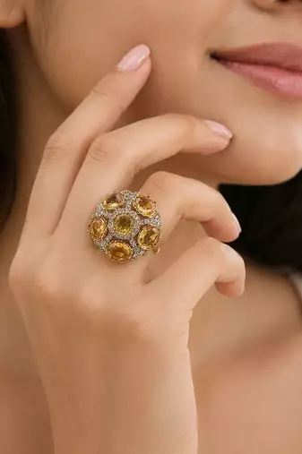 Yellow color american diamond ring featuring stylish crystal fashion appeal