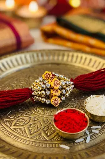 12 pieces combo multi color om design religious thread rakhis with auspicious spiritual handmade design