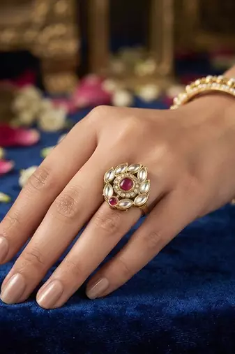 Red color kundan ring featuring beautiful festive fashion jewelry appeal