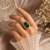 Green color kundan ring featuring premium festive designer appeal