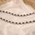 Rani & black color oxidised anklet with traditional floral pattern and elegant ethnic appeal