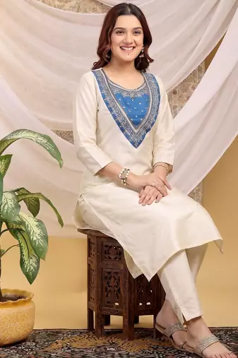 Cream-skyblue color embroidered art silk kurti set full stitched.
