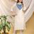 Cream-skyblue color embroidered art silk kurti set full stitched.