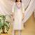 Cream-peach color embroidered art silk kurti set 