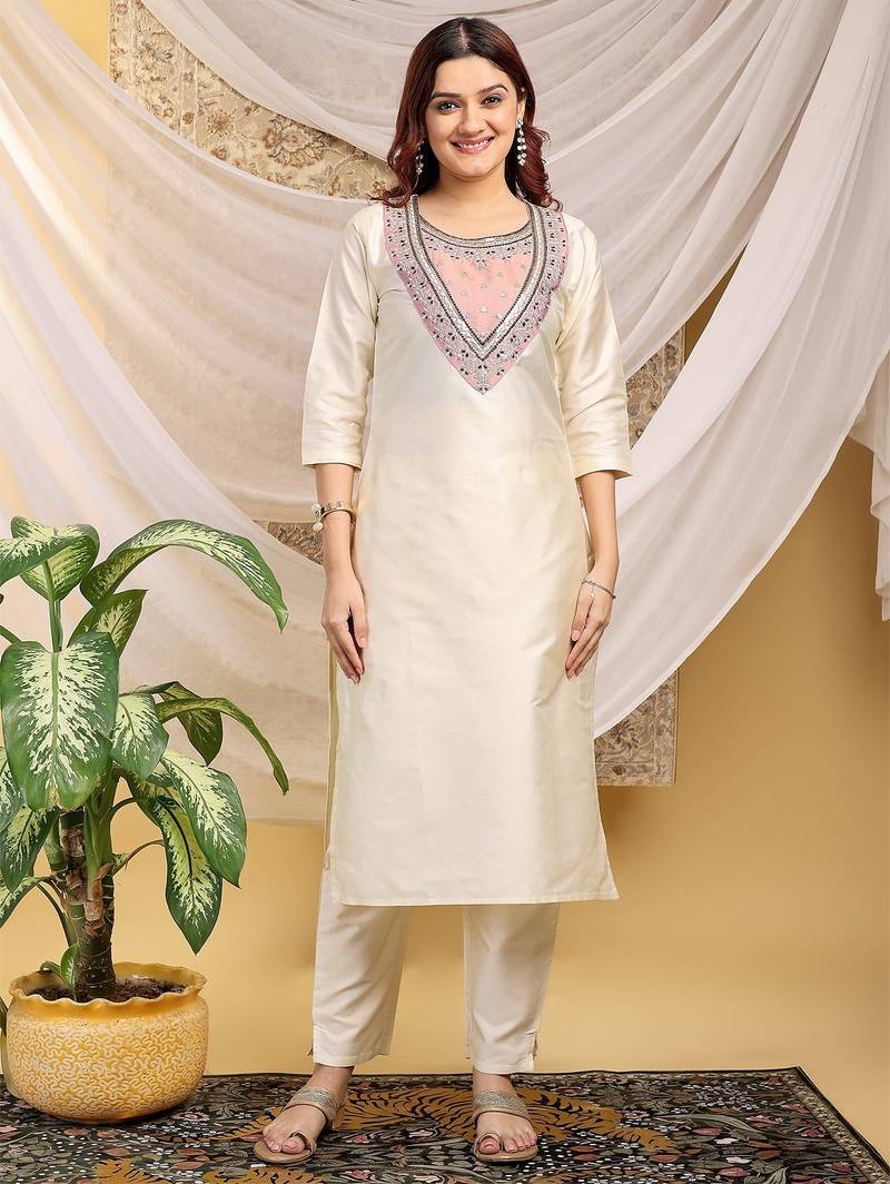 Cream-peach color embroidered art silk kurti set 