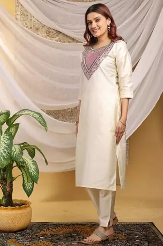 Cream-peach color embroidered art silk kurti set 
