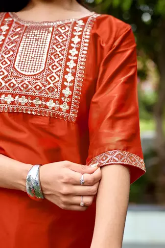 Orange color embroidered art silk party wear kurti set