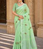 pista green linen woven work traditional saree