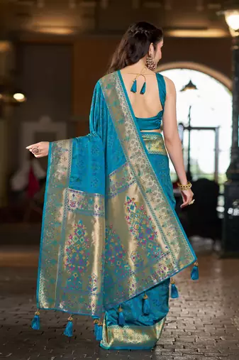Teal blue patola Silk Blend saree with woven zari border & tassels