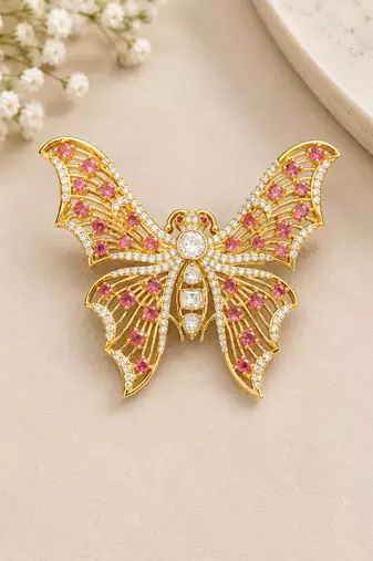 Elegant gold-plated butterfly brooch with pink and clear stone detailing