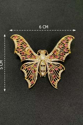 Elegant gold-plated butterfly brooch with pink and clear stone detailing