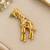 Elegant gold-plated giraffe brooch with multicolor stone embellishments