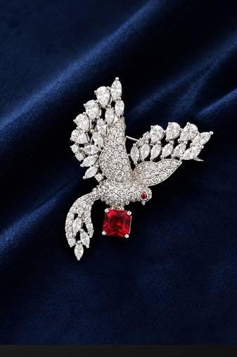 Elegant peacock design brooch with red stone and crystal studded detailing
