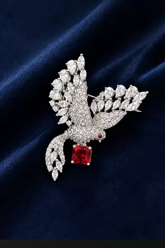 Elegant peacock design brooch with red stone and crystal studded detailing