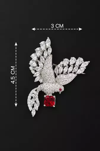 Elegant peacock design brooch with red stone and crystal studded detailing