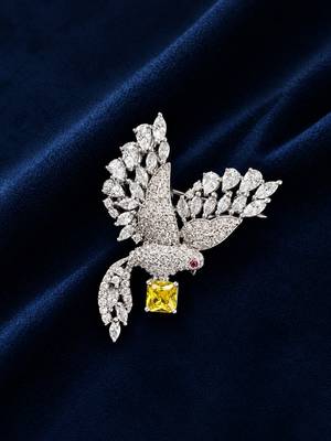 Elegant peacock design brooch with yellow stone and crystal studded detailing 1