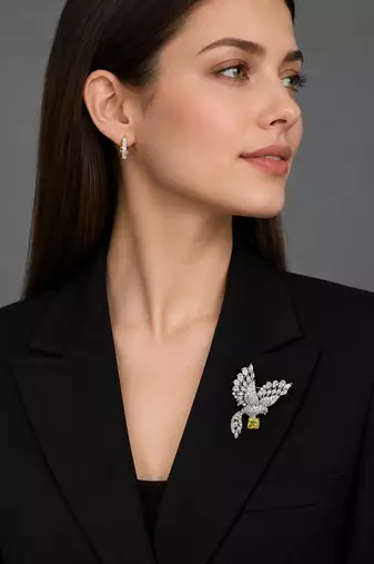 Elegant peacock design brooch with yellow stone and crystal studded detailing
