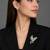 Elegant peacock design brooch with yellow stone and crystal studded detailing