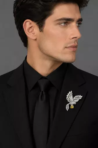 Elegant peacock design brooch with yellow stone and crystal studded detailing