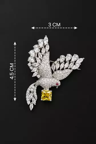 Elegant peacock design brooch with yellow stone and crystal studded detailing