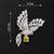 Elegant peacock design brooch with yellow stone and crystal studded detailing