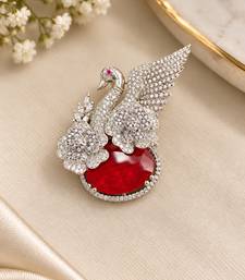 Elegant swan brooch with red crystal and wing shaped cz stone detailing