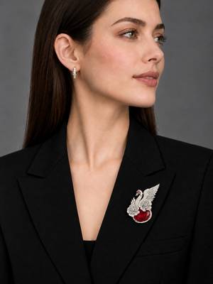 Elegant swan brooch with red crystal and wing shaped cz stone detailing 2