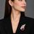 Elegant swan brooch with red crystal and wing shaped cz stone detailing