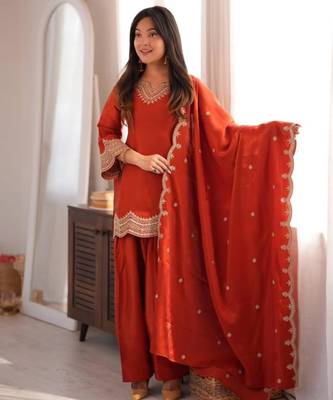 Orange silk blend straight embroidered kurta set for women with dupatta and pant 1