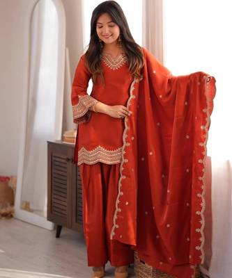 Orange silk blend straight embroidered kurta set for women with dupatta and pant 4