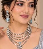 Pista mehandi-plated agate stone necklace set with earrings & maang tikka