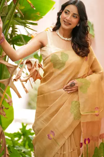 esha linen saree with lotus weave and hand embroidery