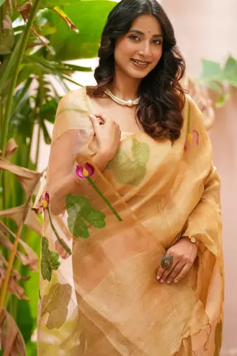 esha linen saree with lotus weave and hand embroidery