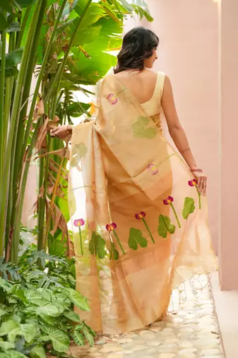 esha linen saree with lotus weave and hand embroidery