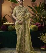 Designer green tissue fabric saree with green tissue blouse fabric