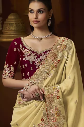 designer yellow soft jacquard fabric saree with maroon silk blend blouse fabric