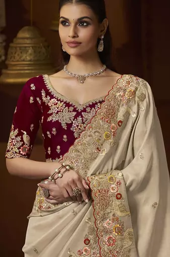 designer gold soft jacquard fabric saree with maroon silk blend blouse fabric