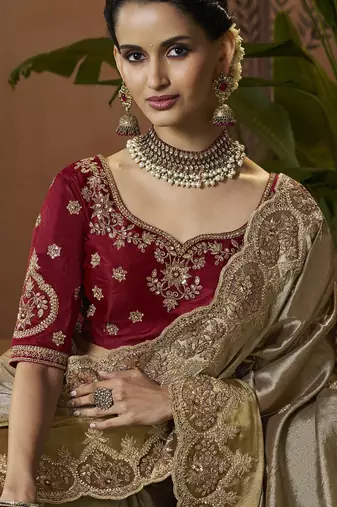 designer gold viscose fabric saree with maroon silk blend blouse fabric