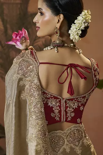 designer gold viscose fabric saree with maroon silk blend blouse fabric