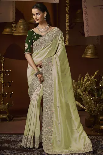 designer green jacquard fabric saree with green silk blend blouse fabric
