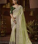 designer green jacquard fabric saree with green silk blend blouse fabric