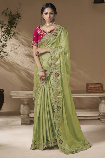 designer green viscose fabric saree with rani pink silk blend blouse fabric