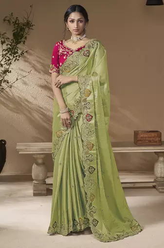 designer green viscose fabric saree with rani pink silk blend blouse fabric