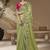 designer green viscose fabric saree with rani pink silk blend blouse fabric