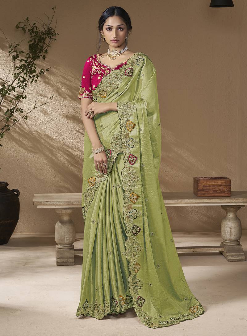 designer green viscose fabric saree with rani pink silk blend blouse fabric