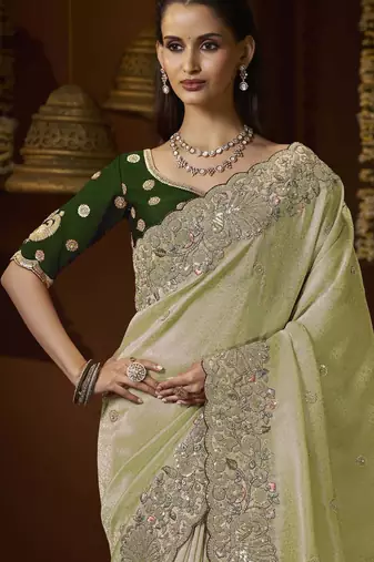 designer green jacquard fabric saree with green silk blend blouse fabric