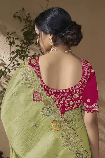 designer green viscose fabric saree with rani pink silk blend blouse fabric